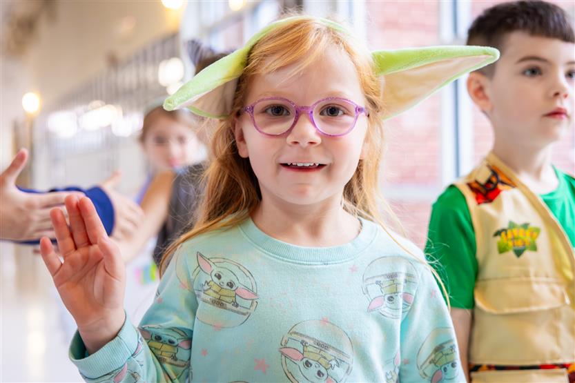 Students participate in an alphabet parade